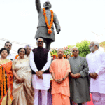 CM Yogi Adityanath paying tribute to Hemwati Nandan Bahuguna in Lucknow